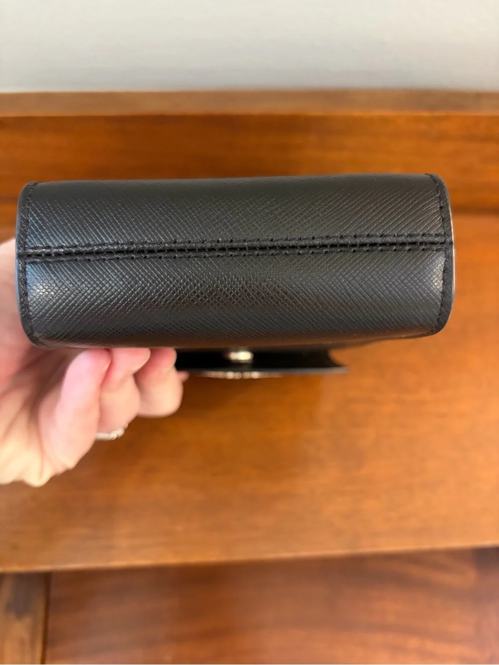 kate spade black saffiano leather phone pouch with gold logo